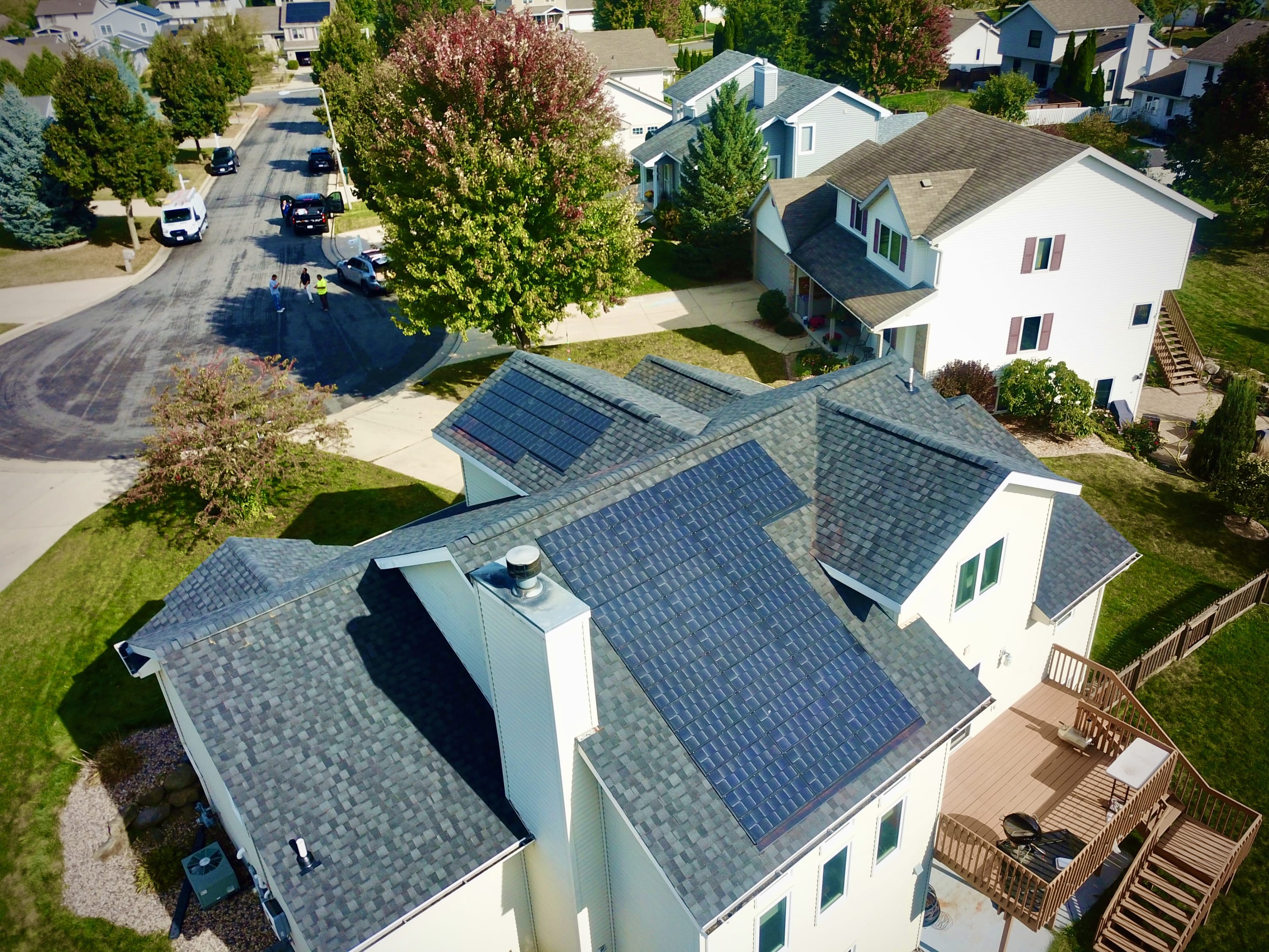 Array of solar shingles integrated with the asphalt roofing system on a residential rooftop in Madison, WI. Installed by Sun