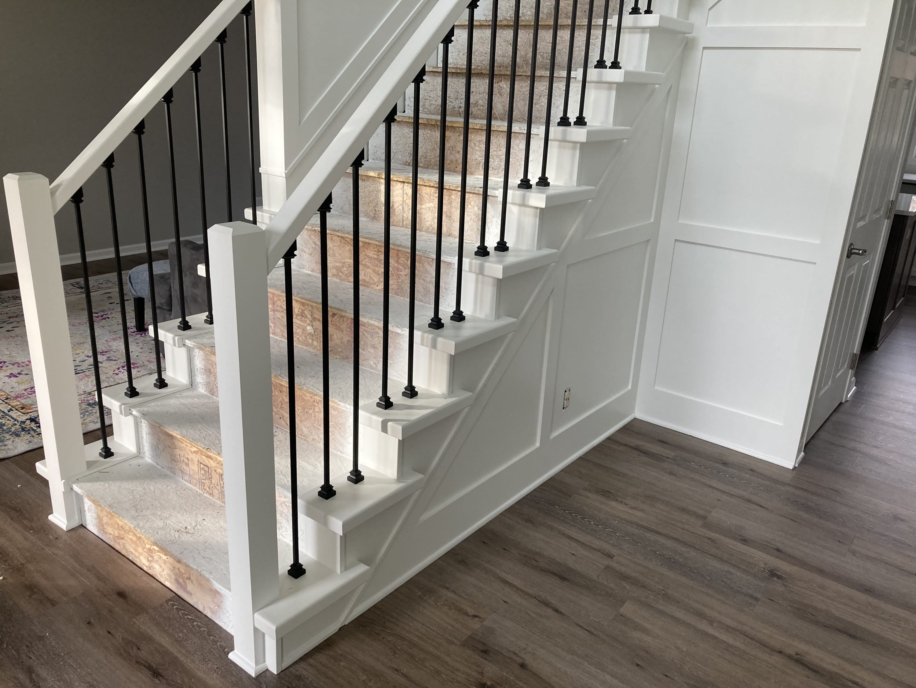 Stair rail, spindles, wainscot