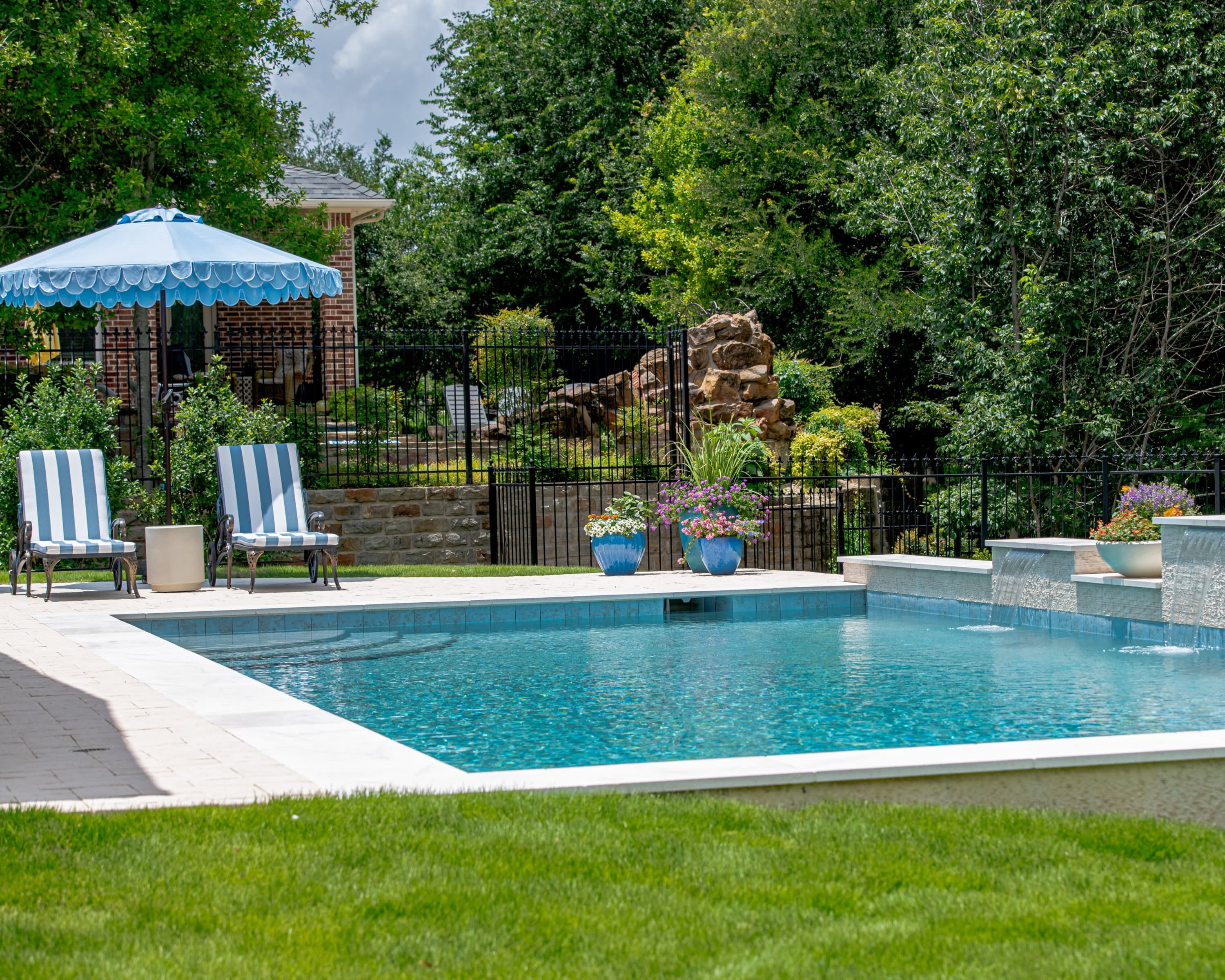 Luxury geometric pool with sheer descents by Canyon Oak Pools in McKinney, TX