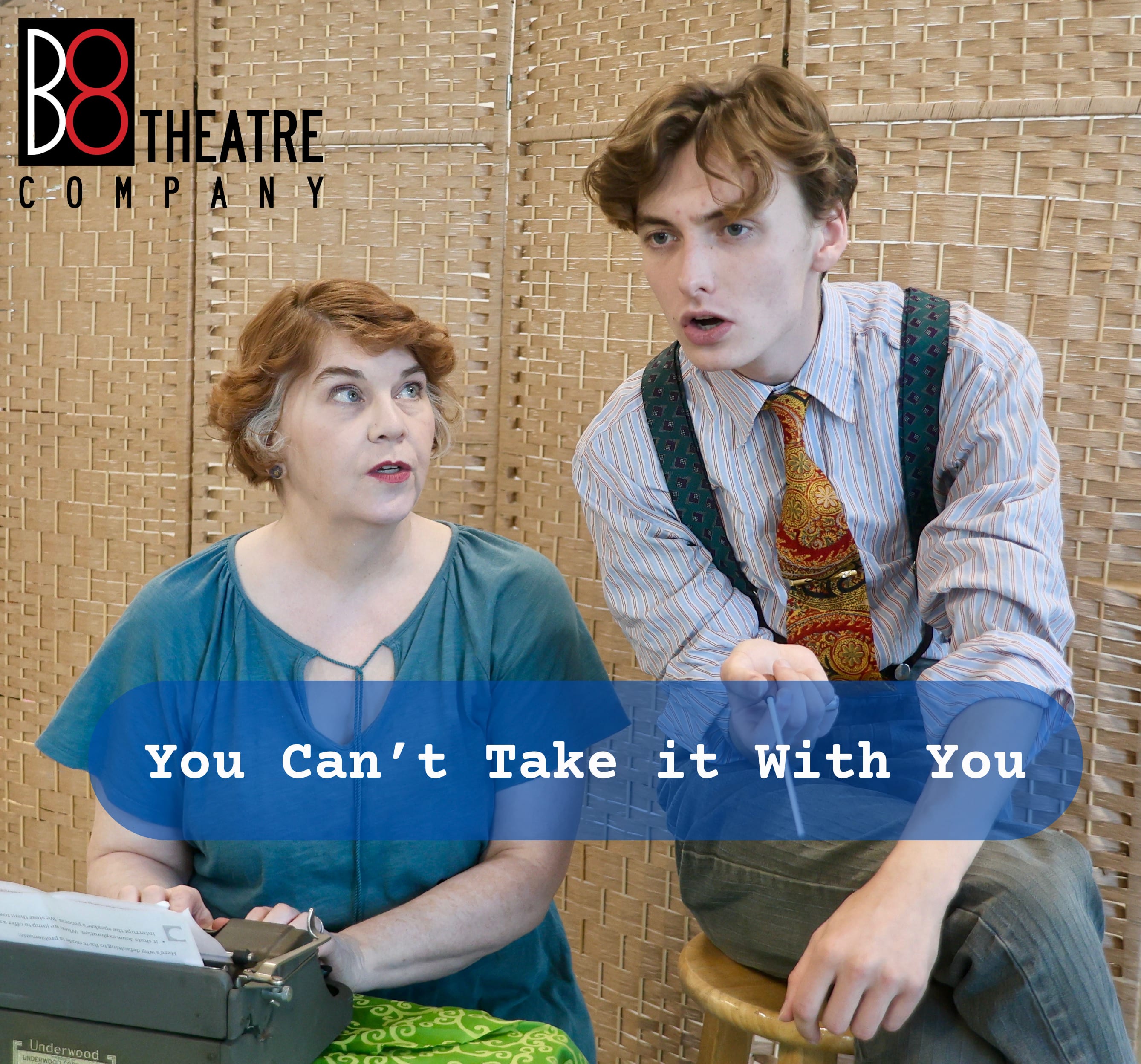 Penny (JanLee Marshall) and Ed (William Lewis) gather around a typewriter in B8 Theatre Company's production of You Can't Tak