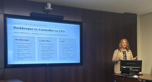 a woman presenting with a screen behind her showing a slide Bookkeeper vs Controller vs CFO