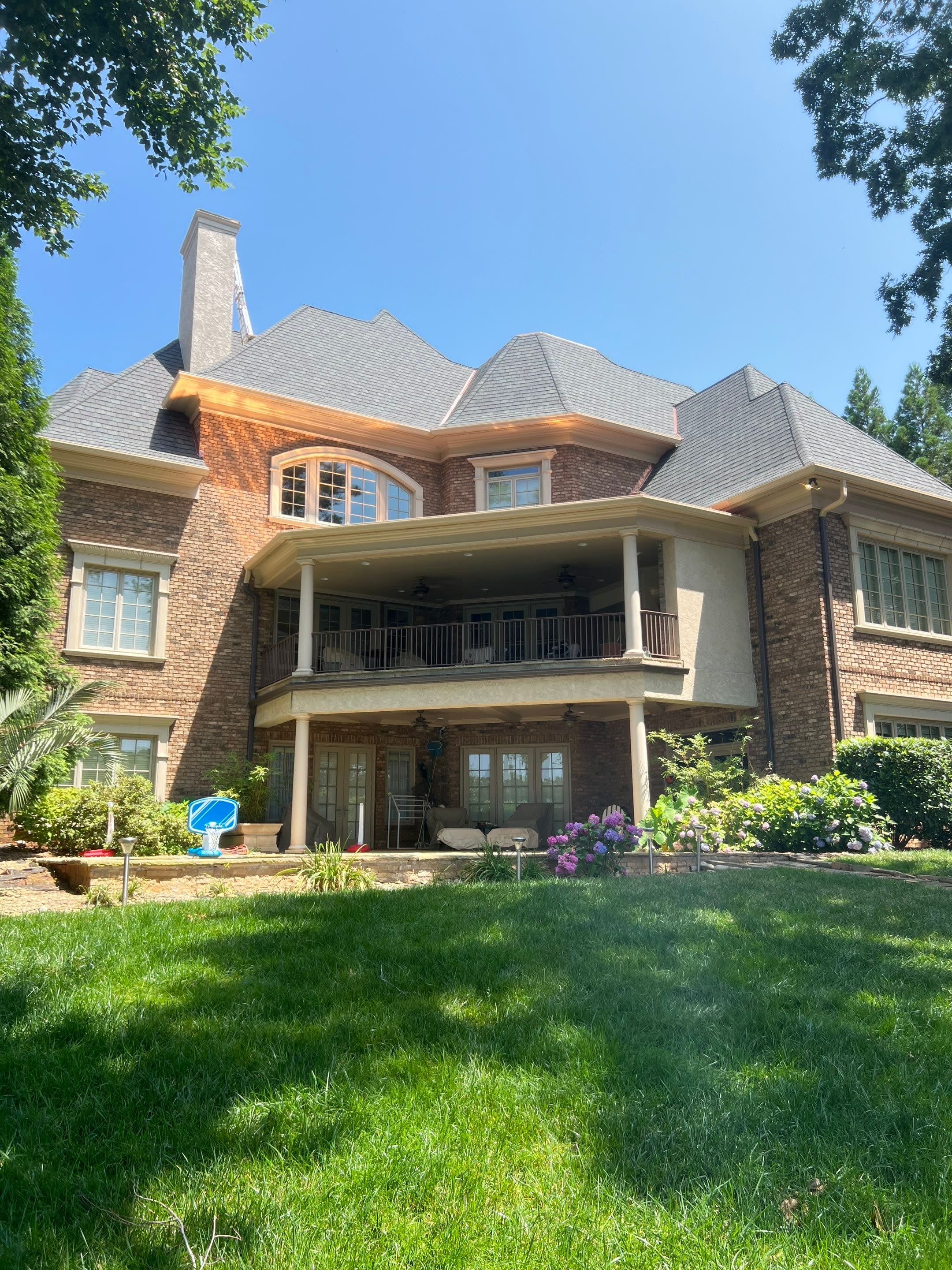 House with new architectural shingles and copper roof