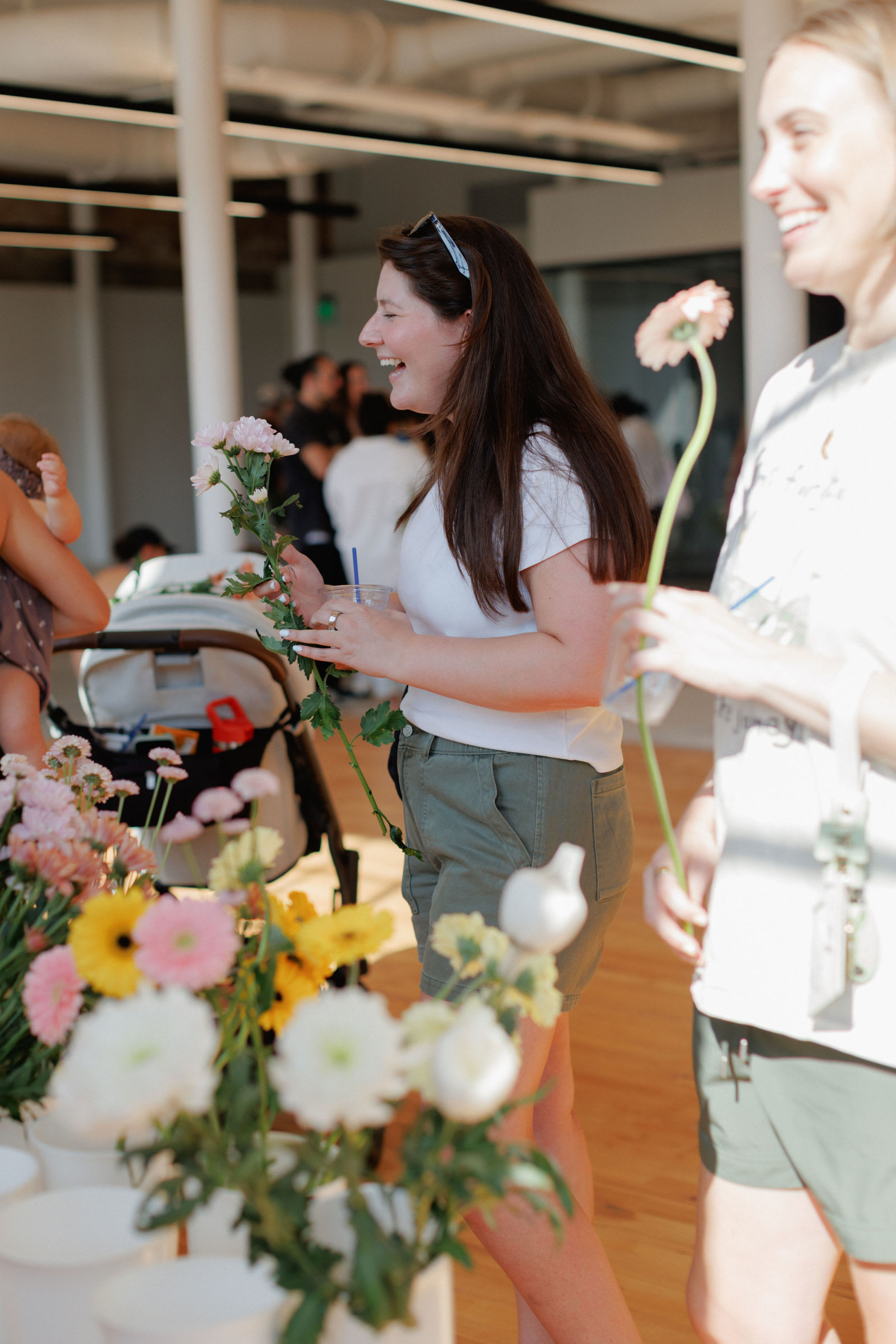 women building a bouquet at a flower bar