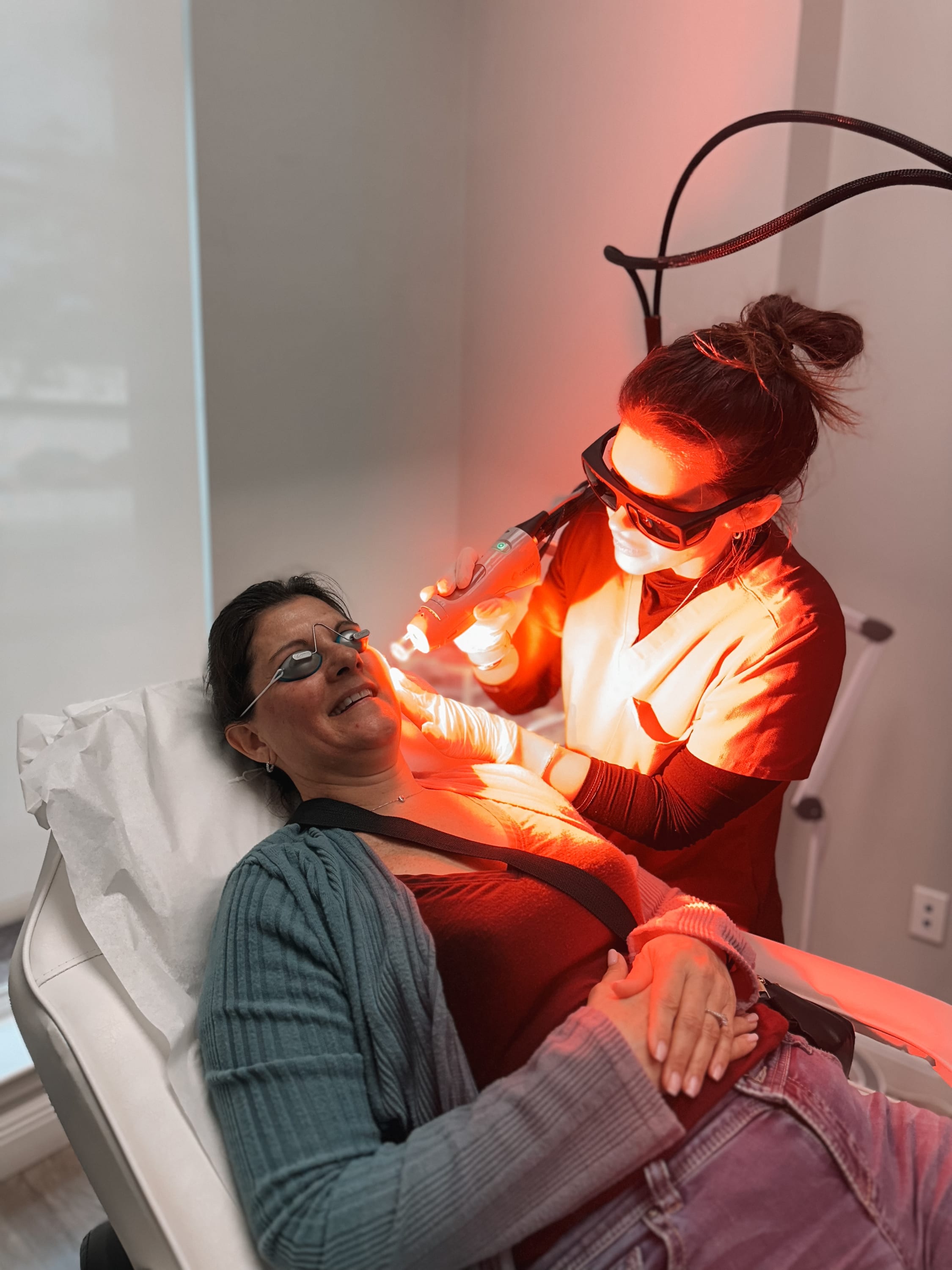 Patient receiving a facial laser skin treatment at Refresh - Aesthetics & Wellness in Florida