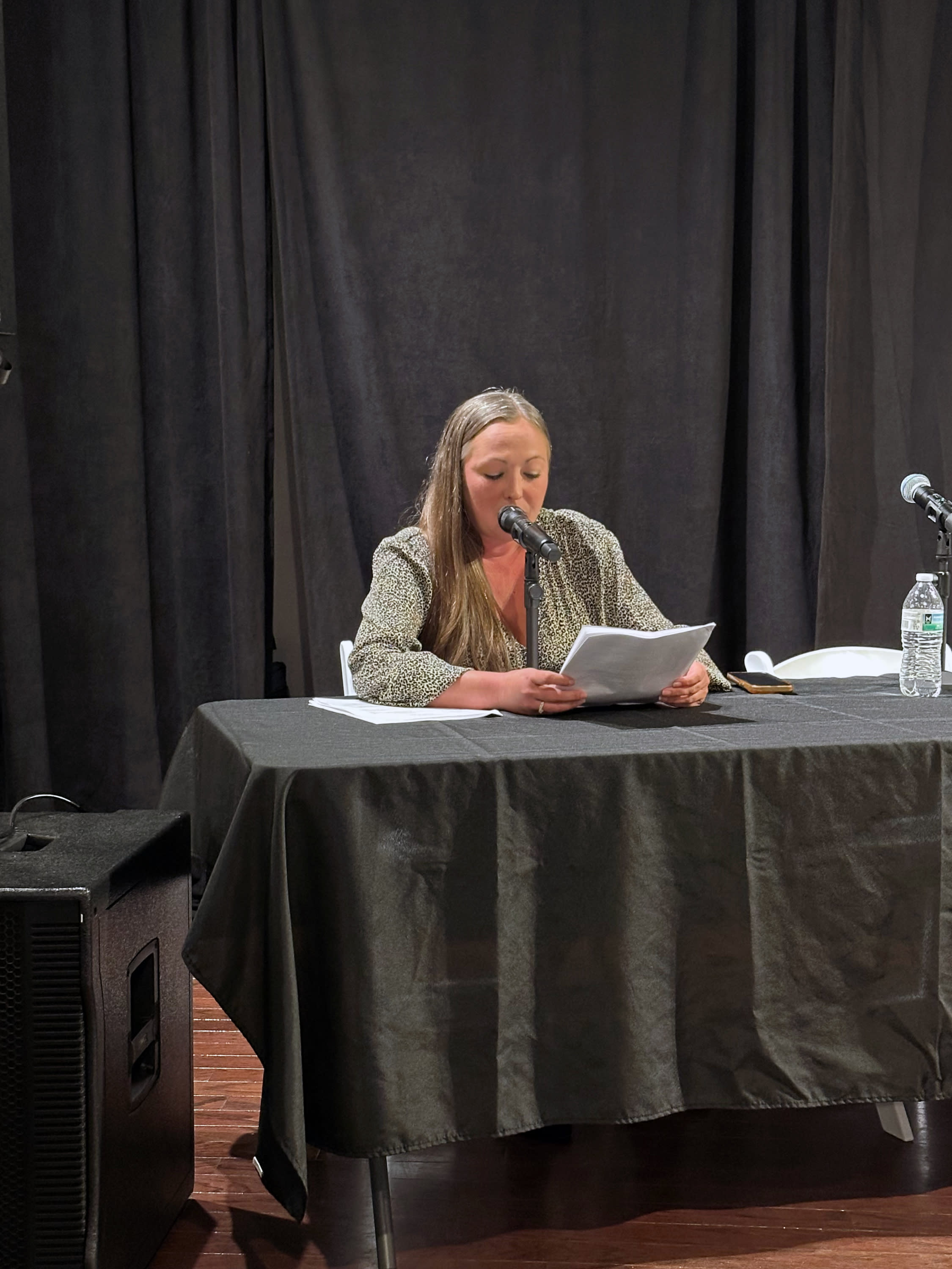 A moderator speaks during the Young Professionals Political Pulse candidate forum.