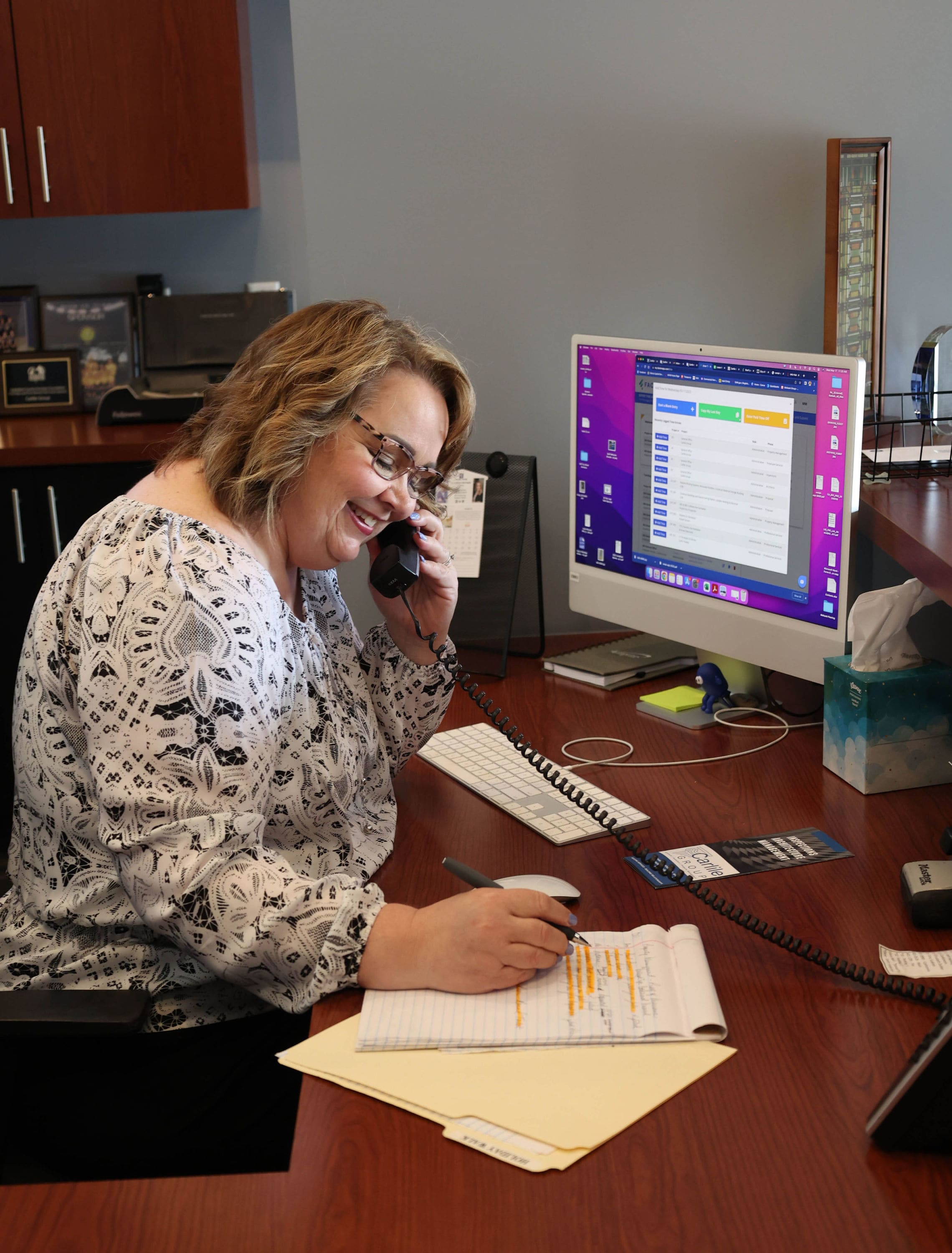 Administration Staff, Melissa happily working at the front desk