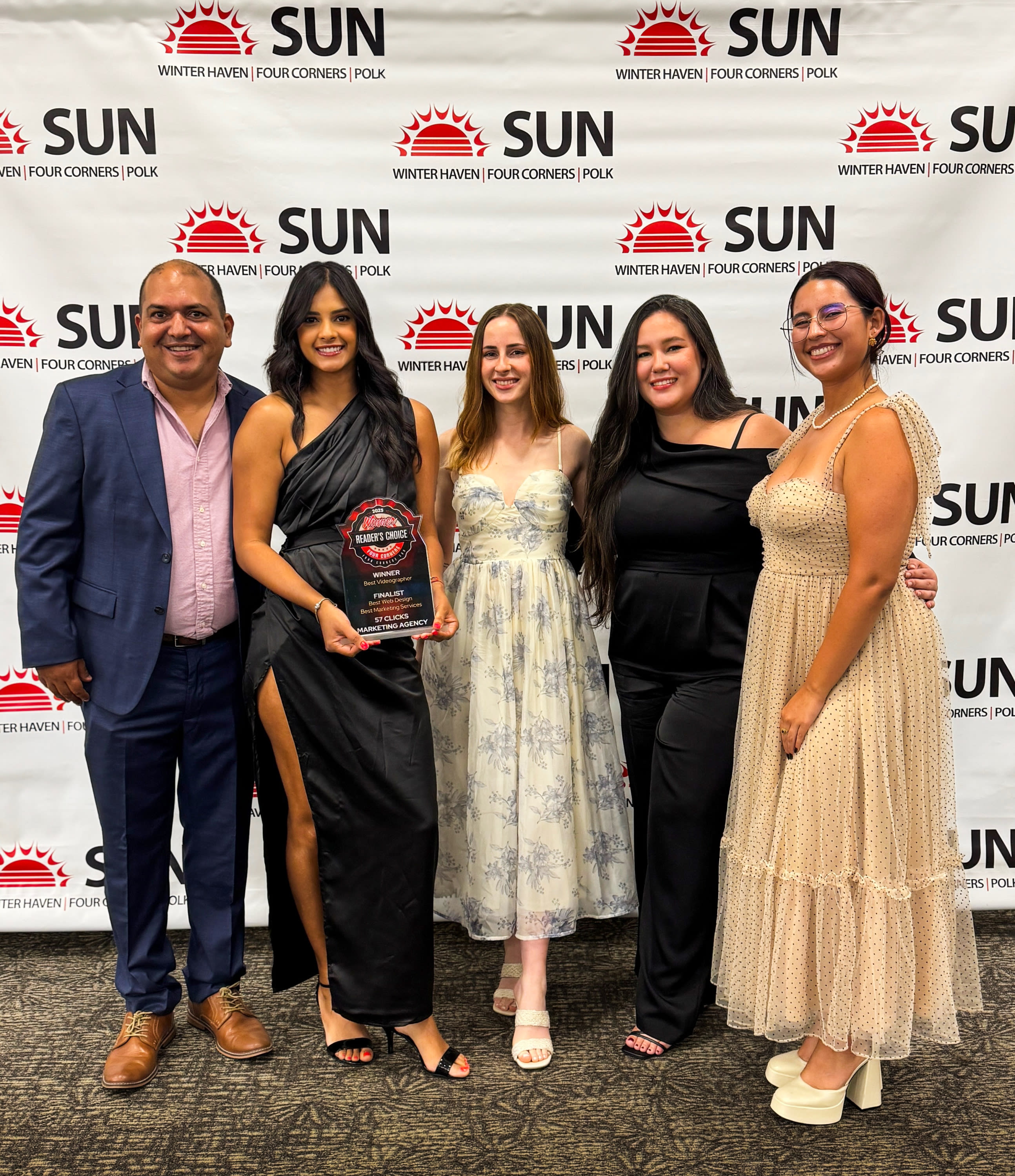 57 Clicks Marketing Agency team receiving a Four Corners Readers’ Choice Award in Central Florida