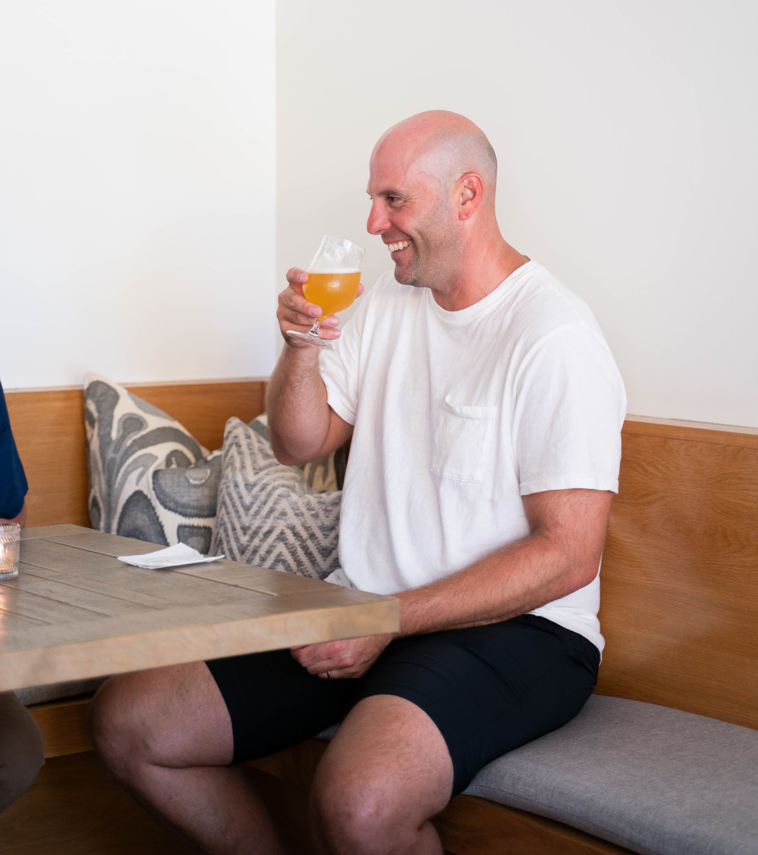 Guest enjoying a craft beer at Sonoma Wine & Cheese in Katy, TX