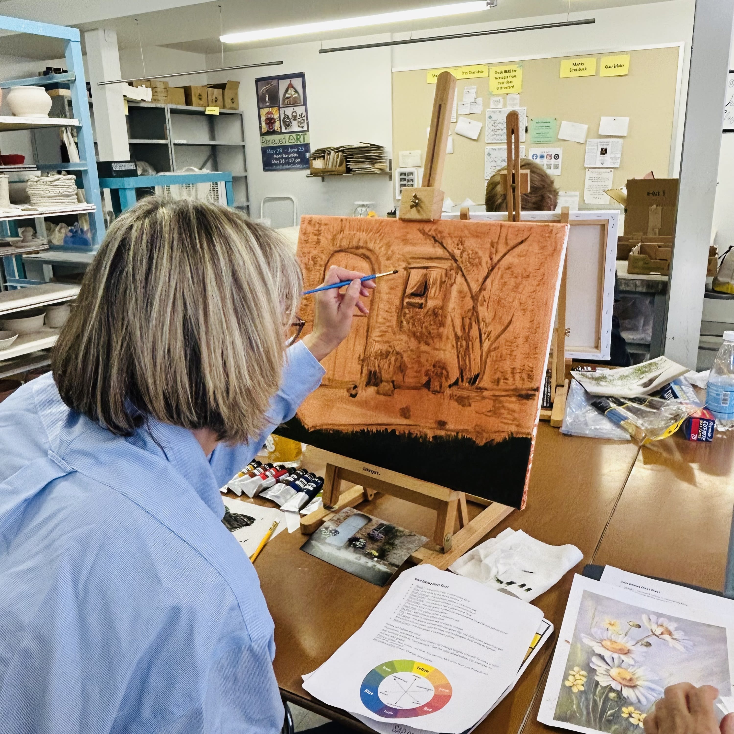 Student working on a painting