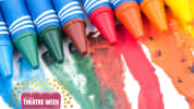 rainbow crayons melting on a white background