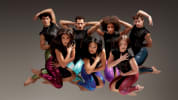 seven dancers jumping in interesting shapes