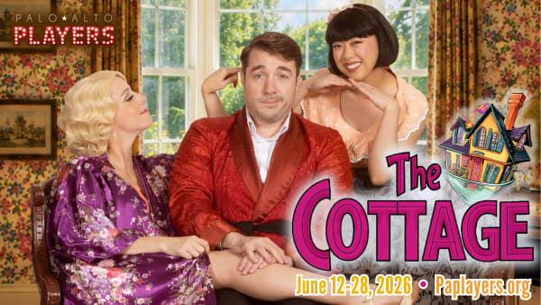 Beau (Steve Allhoff) and Sylvia (Kate McGrath) cuddle on the couch at THE COTTAGE.
