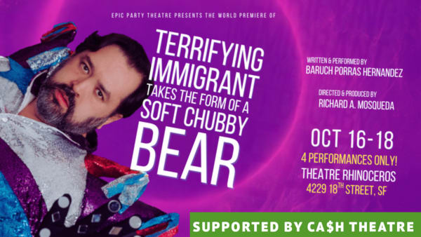 A dark-haired, light-skinned and bearded man is wearing a sparkly outfit with his hand pressed against the screen against a p