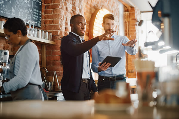 restaurant owners in a restaurant bar
