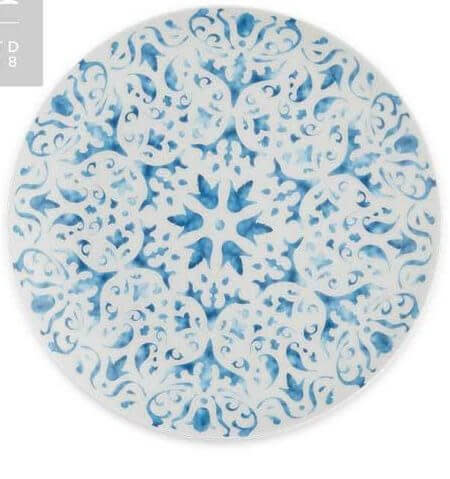Round ceramic plate with detailed blue and white floral patterns.