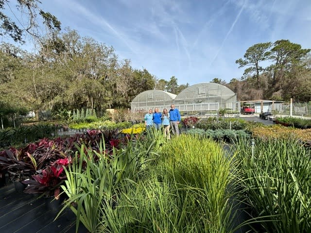 Members of the Colorscape team in front of the greenhouses