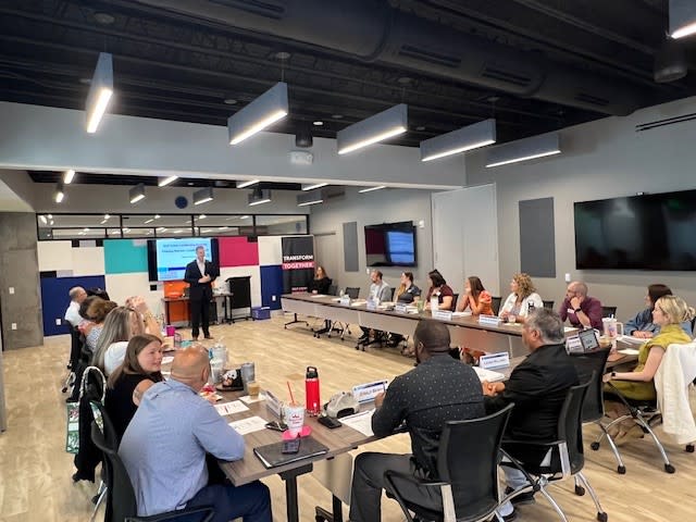 A group of people in a conference room