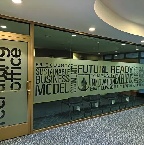Frosted window graphics on a glass wall in an office