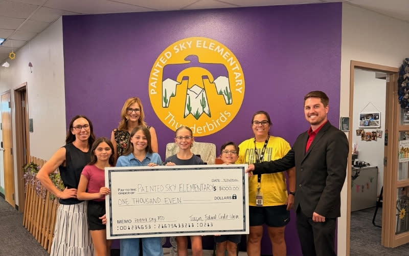 TFCU Branch Manager Jace Garrish Presents Check to Painted Sky Elementary PTO