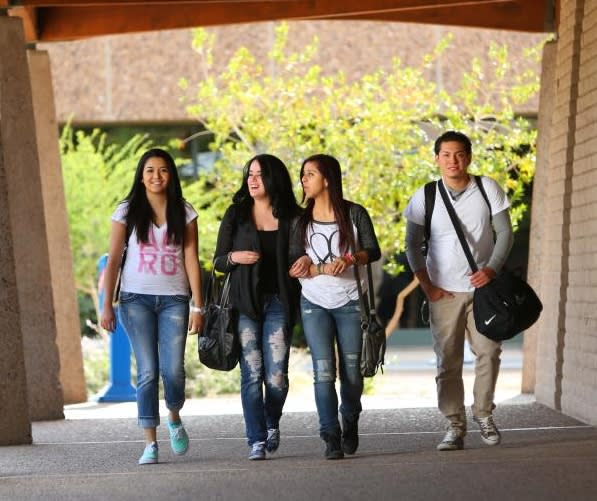 College students walking down hallway