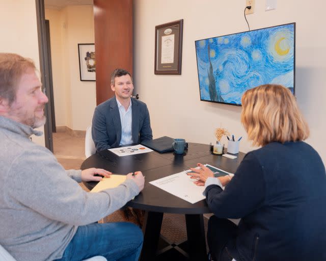 Financial advisor meeting with clients about retirement planning