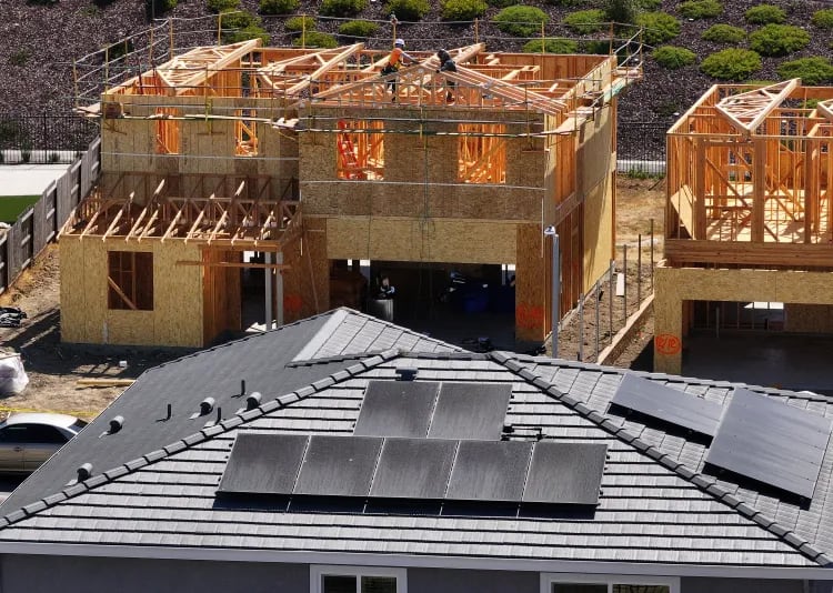 In an aerial view, construction workers build a home at a new housing development on July 1, 2025 in Richmond, California. |