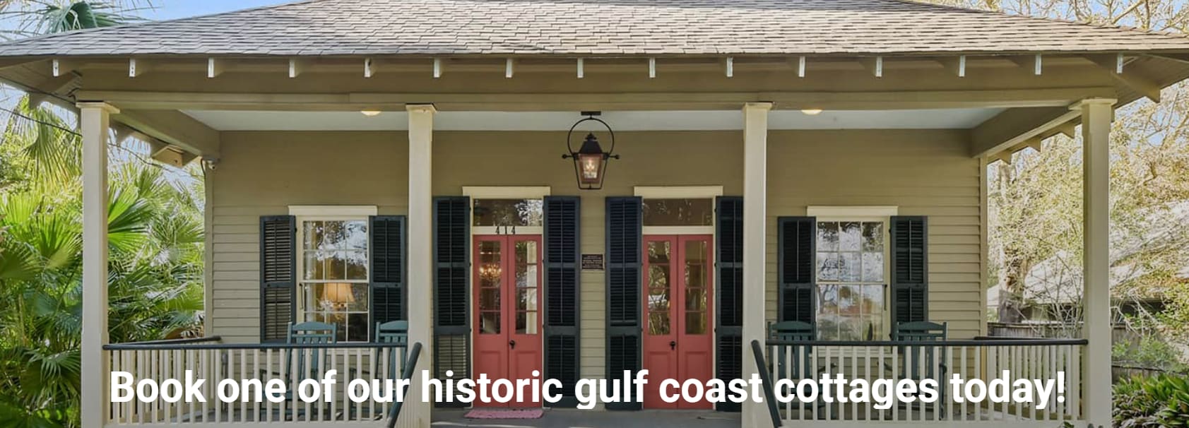 Bay St Louis Cottages  Showing a front porch with red doors.