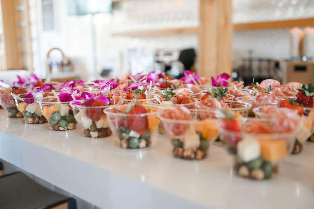Charcuterie cups with cheese, fruit, and cured meats at Sonoma Wine & Cheese in Katy, TX
