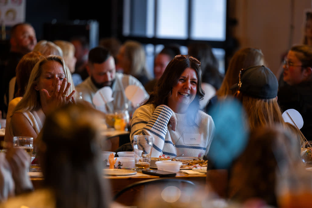 shot of attendees. people laughing.