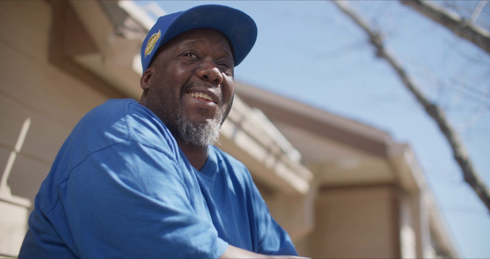 Scott Washington laughs as he looks up outside his apartment in his SAMMinistries Journeys of Hope story.