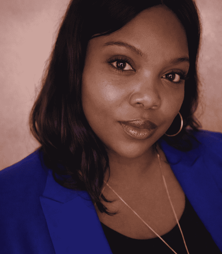 Headshot of Tiffany The Diamond, a female African American life coach smiling warmly, representing her business Radiantly Cro