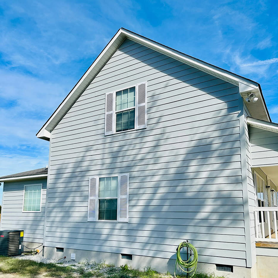 Exterior wall painting on a home in Burleson TX by AK Painting Services