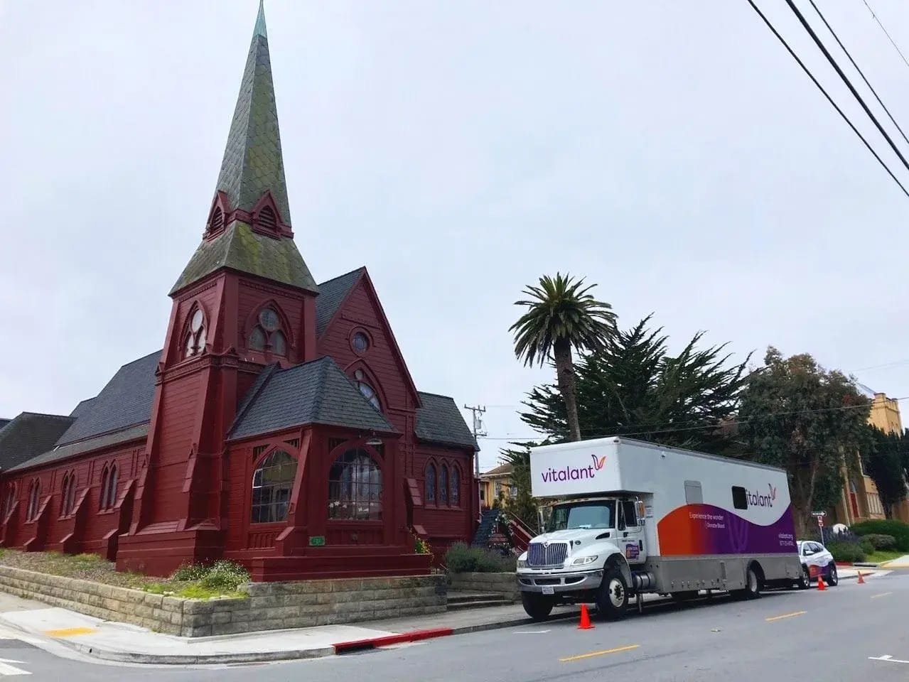 Bloodmobile in front of red church