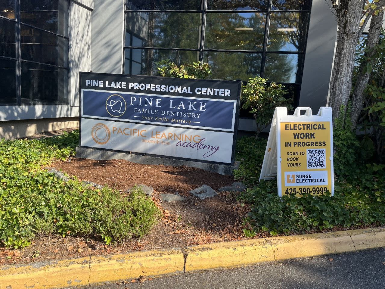 Electrical work in progress sign by Surge Electrical outside Pine Lake Professional Center in Sammamish WA.