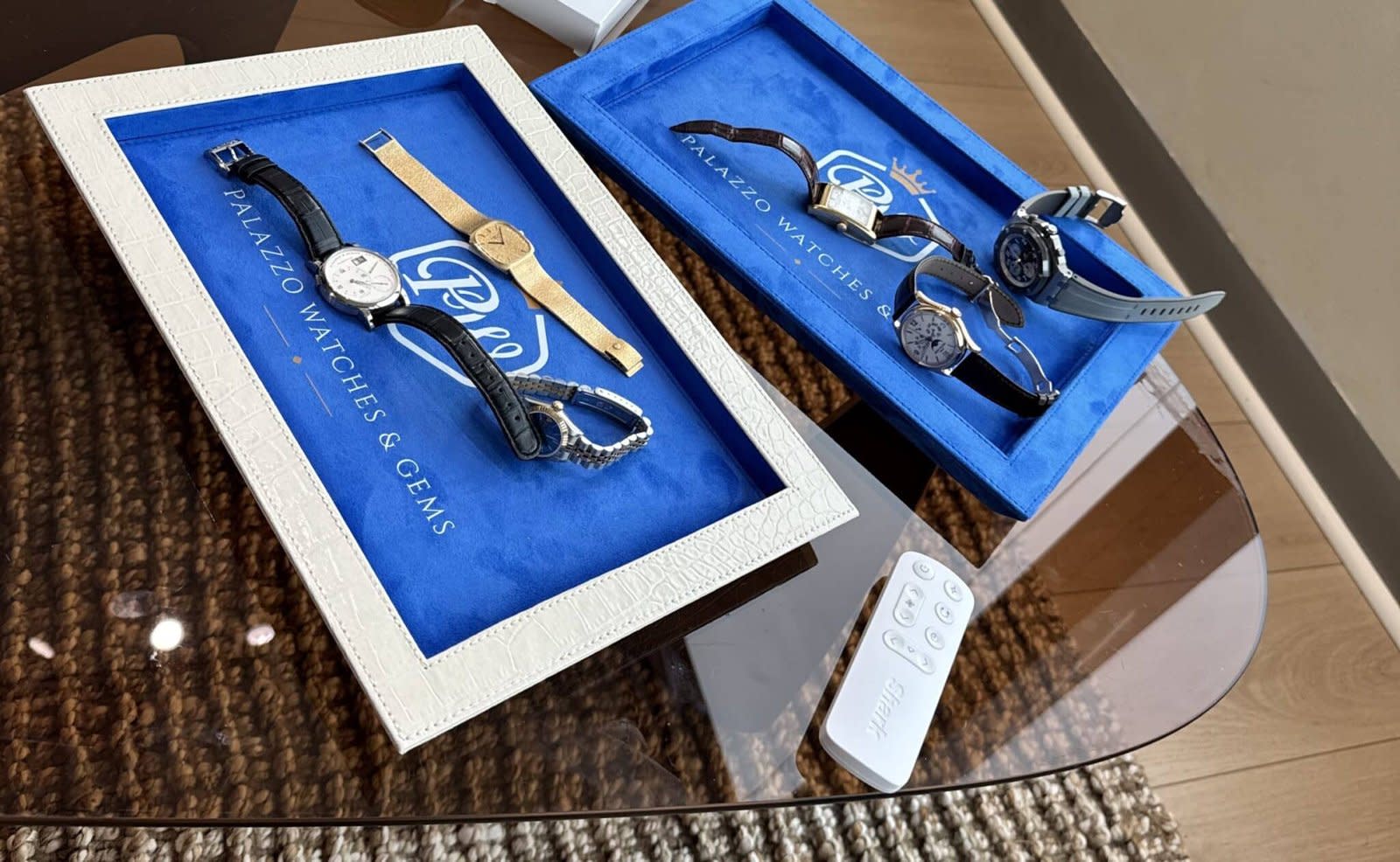 Pre-owned luxury watches on Palazzo Watches & Gems branded trays