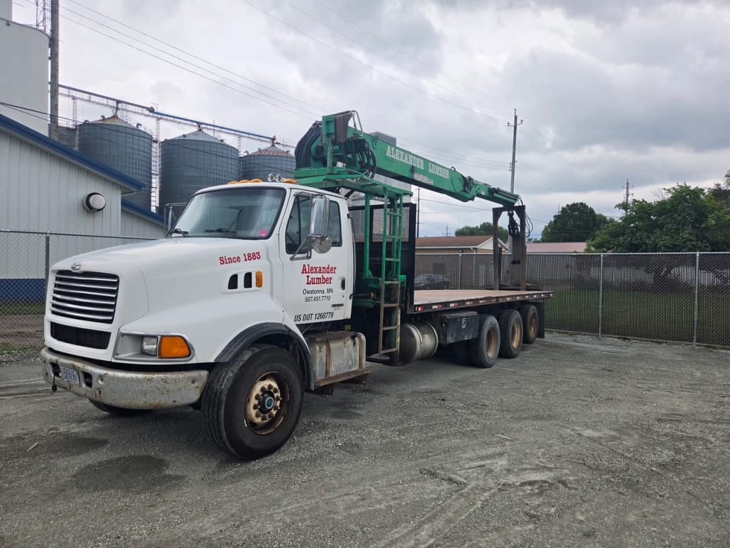 2000 Sterling pallet fork boom truck, front driver-side view