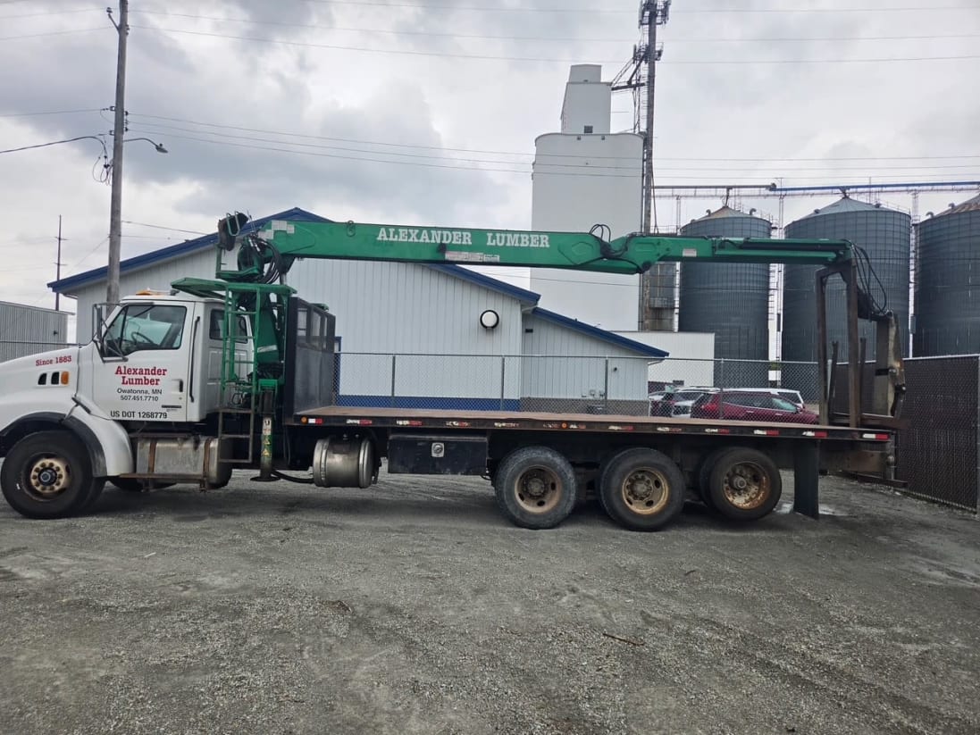 2000 Sterling pallet fork boom truck, side view