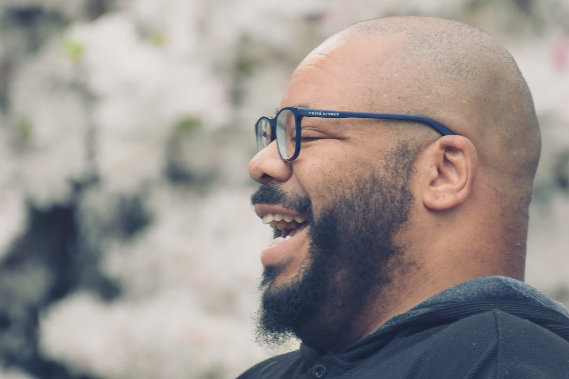 Dan Kimbrough headshot, looking camera left laughing