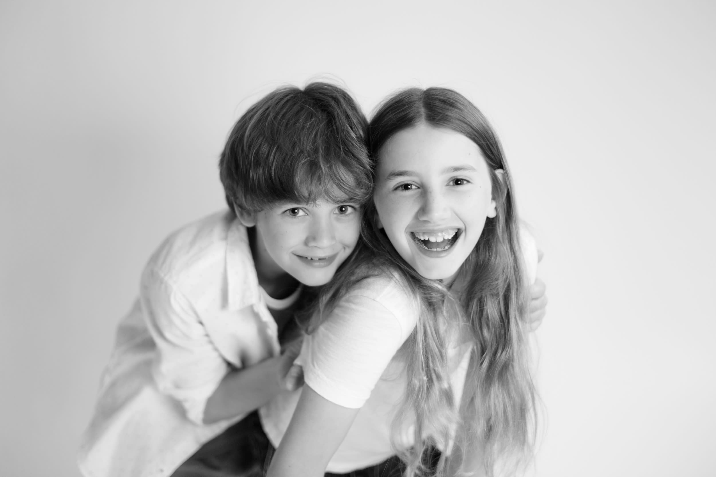 studio photograph of siblings
