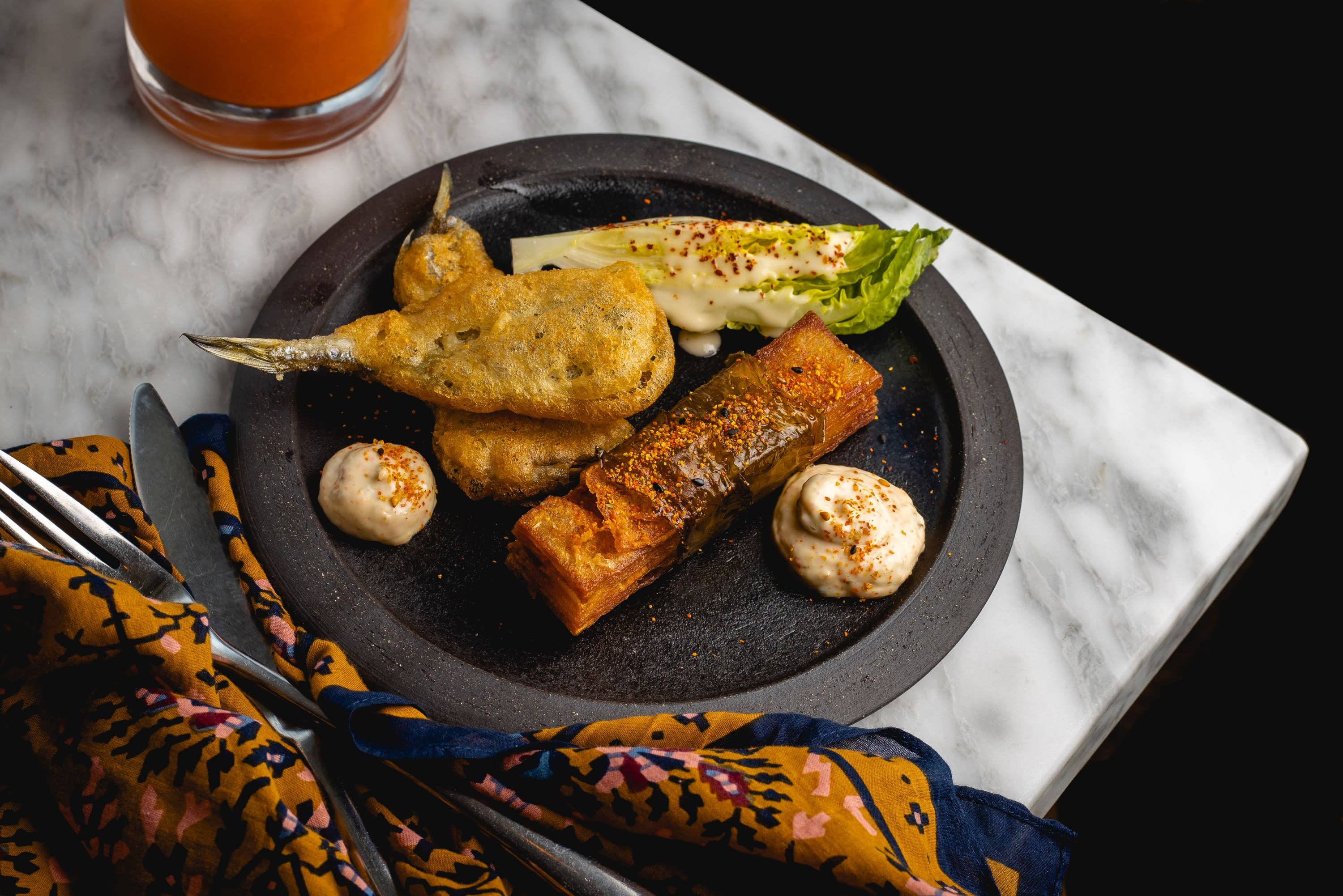 Fried Smelt on a black plate