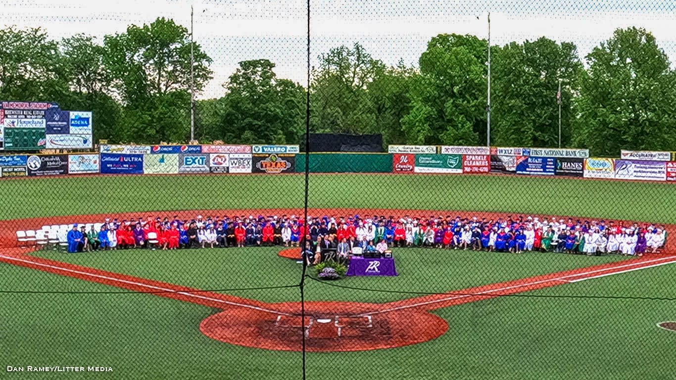 photo of people standing on baseball field