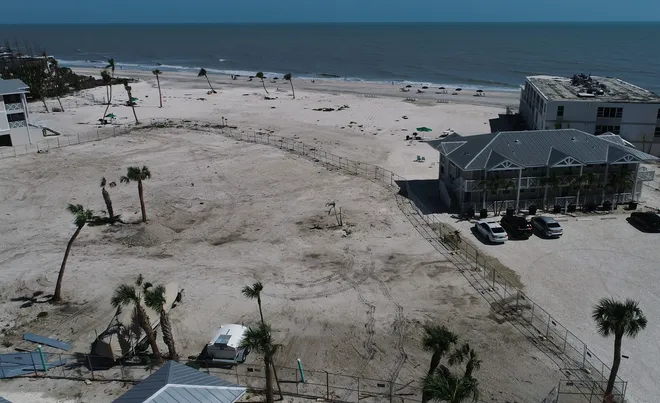 This aerial view along West Gulf Drive on Sanibel Island was captured May 1 and shows the empty swath of land where a part of the Island Inn resort used to stand. The impact from Hurricane Ian last year caused severe devastation throughout the island.