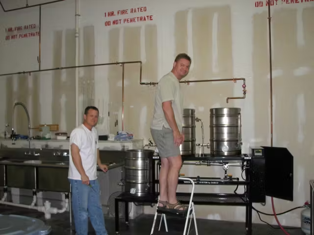 a man standing in a kitchen preparing food