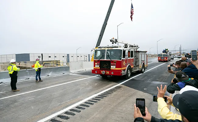 A fire engine is the first to cross the reopened section of I-95 in Philadelphia