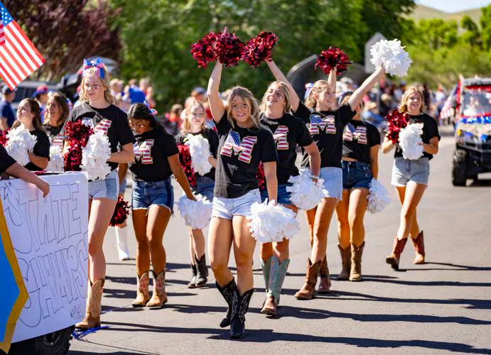 (Rick Egan | The Salt Lake Tribune) Morgan High cheerleaders perform in the Morgan parade on Thursday, July 4, 2024.
