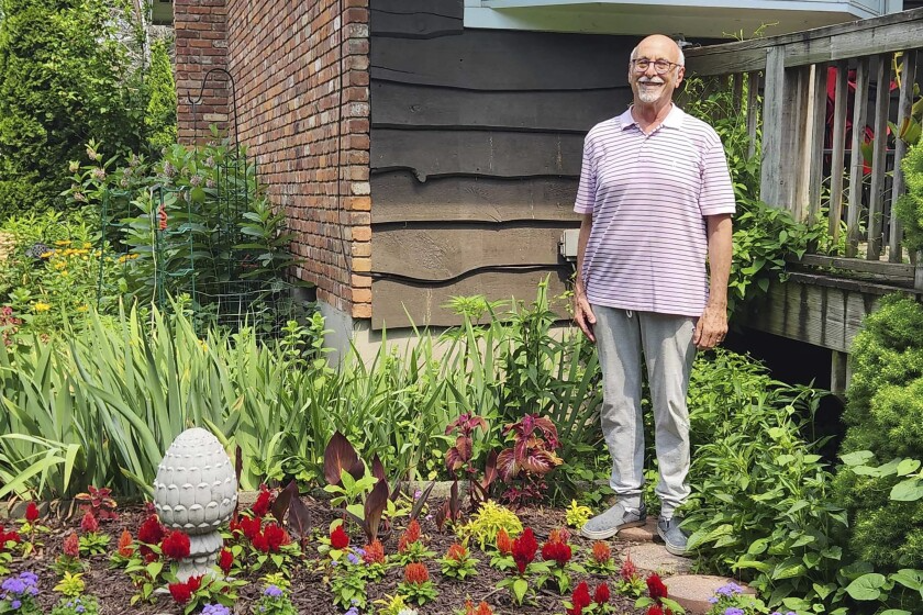 Jeff Kellert stands in his garden