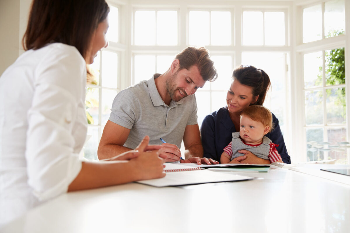 Family of three signing a renovation contract