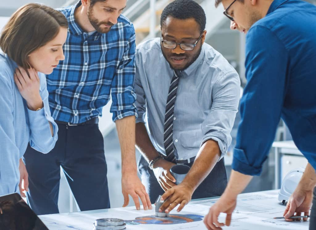 Diverse Group of Engineers, Technicians, and Specialists on a Meeting