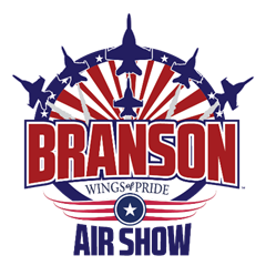 A logo with red white and blue letters and a circle with jets 
Description automatically generated