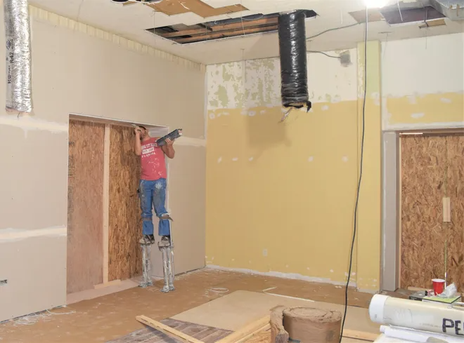 Bryan Dry Wall employees work on the new offices at the Holmes County Chamber of Commerce. "Think rest stop," says Tiffany Gerber about the renovations. "Visitors will be able to come in and pick up information even if we aren
